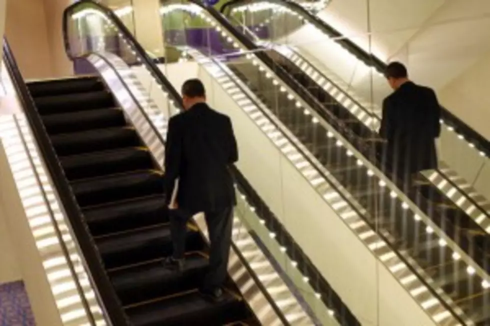 Manager Saves Kid Falling Off Escalator [VIDEO]