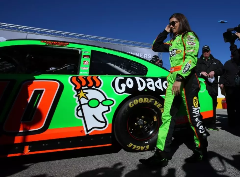 Danica Patrick alongside her #10 GoDaddy.com Chevy at Daytona International Speedway (Getty Images)