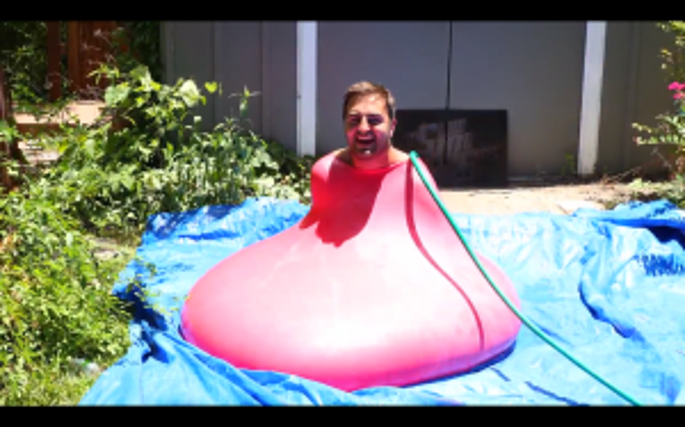 Watch: 6-Foot Man Gets in Giant Water Balloon [VIDEO]