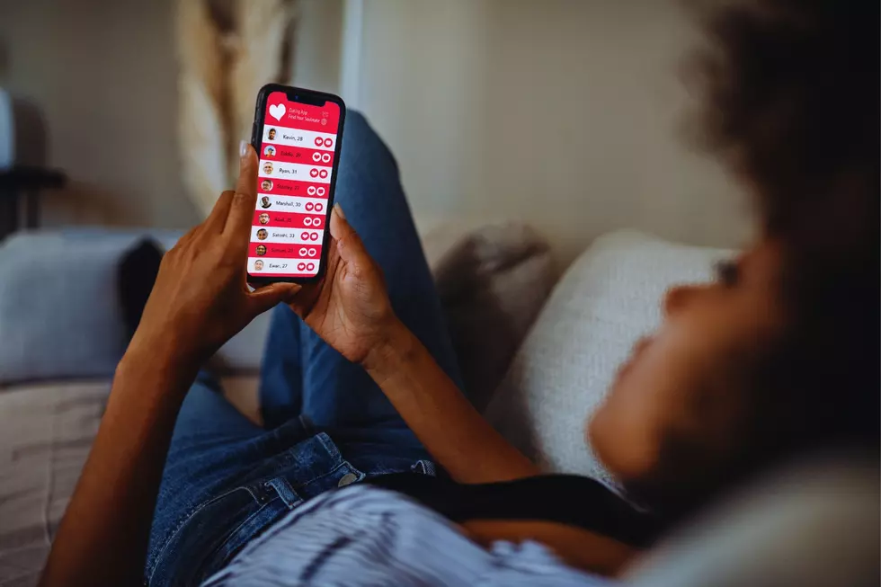 Woman scrolling dating app on phone