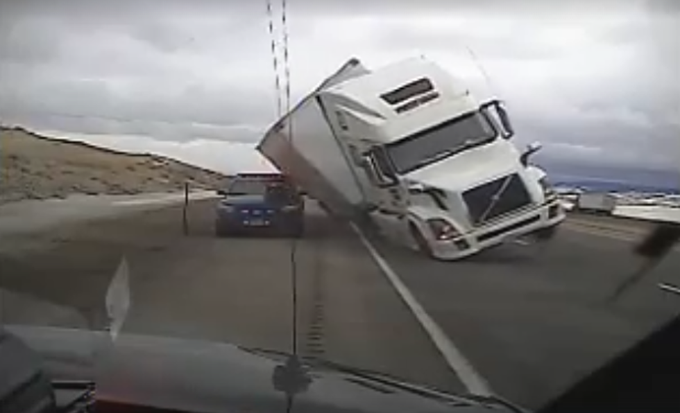 Wyoming Highway Patrol Vehicle Crushed by Blown Over Semi [VIDEO]