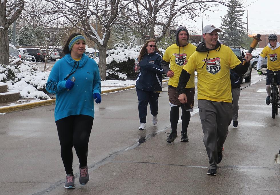 Casper Police, Kelly Walsh Students Carry the Torch for Special Olympics