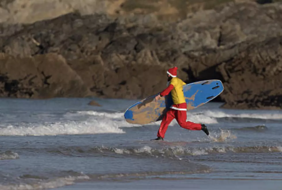 Frigid weather doesn’t stop Santas surfing off Florida coast