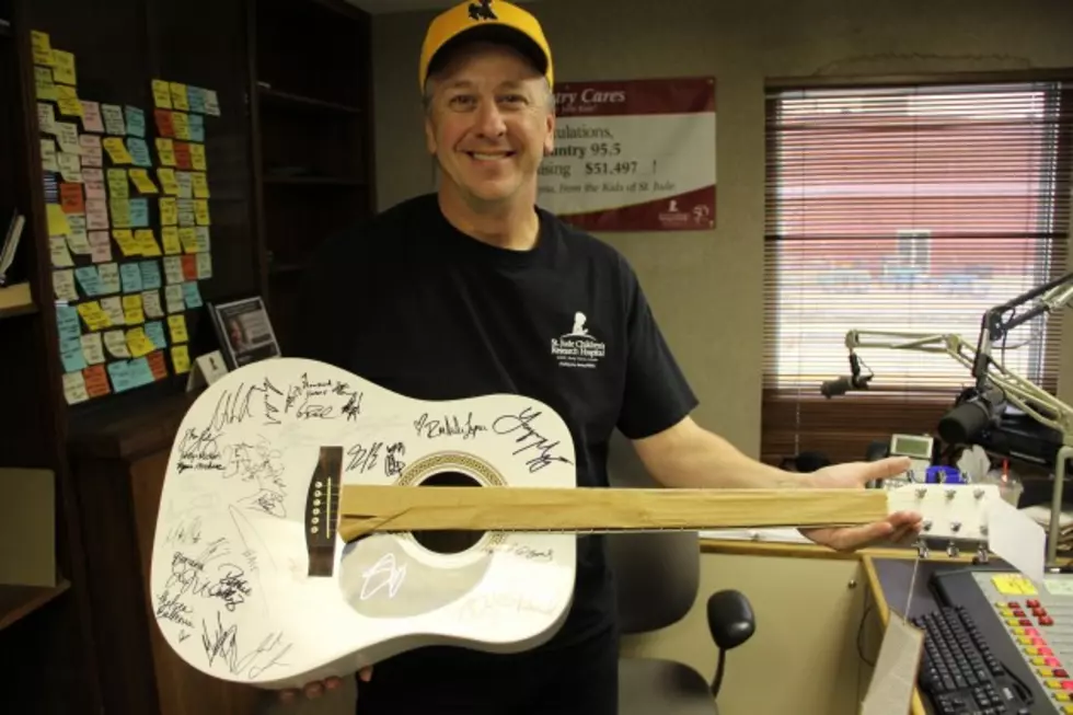 Guitar Signed By Country Stars Can Be Yours By Becoming a Partner in Hope