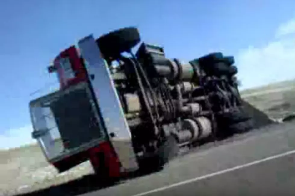 Semi Blows Over On Top Of Wyoming Highway Patrol Car [Video]