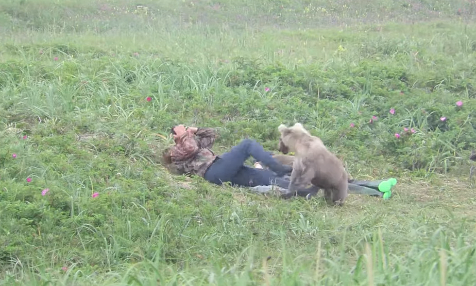 Watch Two Sleeping Guys Get Hilariously Woke Up By a Bear Cub