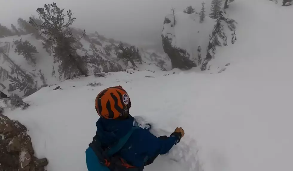 Watch a Snowboarder Avoid an Avalanche by Grabbing a Rock Face