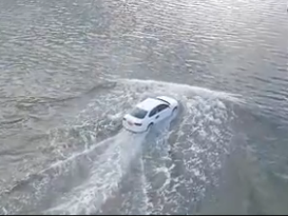 Crazy Uber Driver Attempts to Drive Over Flooded Bridge [VIDEO]