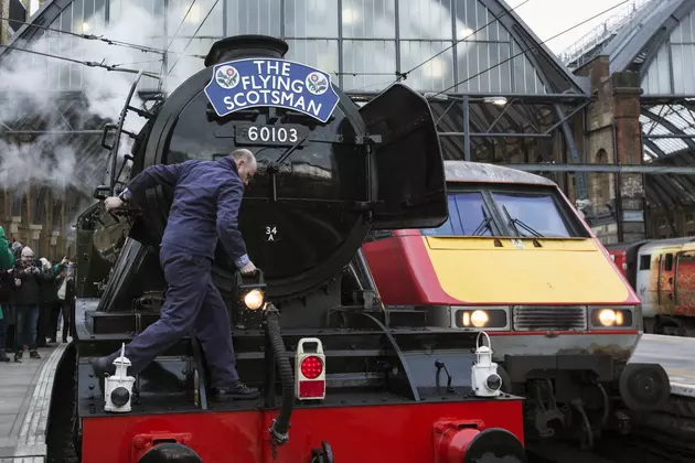Thousands Line Tracks to See Famed Steam Engine Leave London
