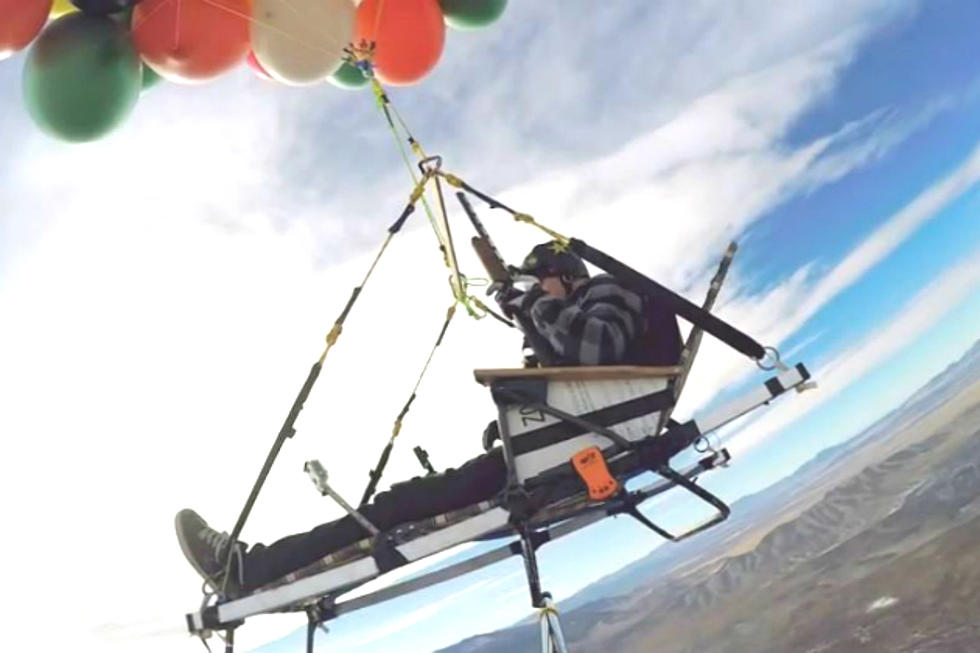 A Man Ascends to 8,000 Feet in His Weather Balloon Powered Lawnchair Then Skydives