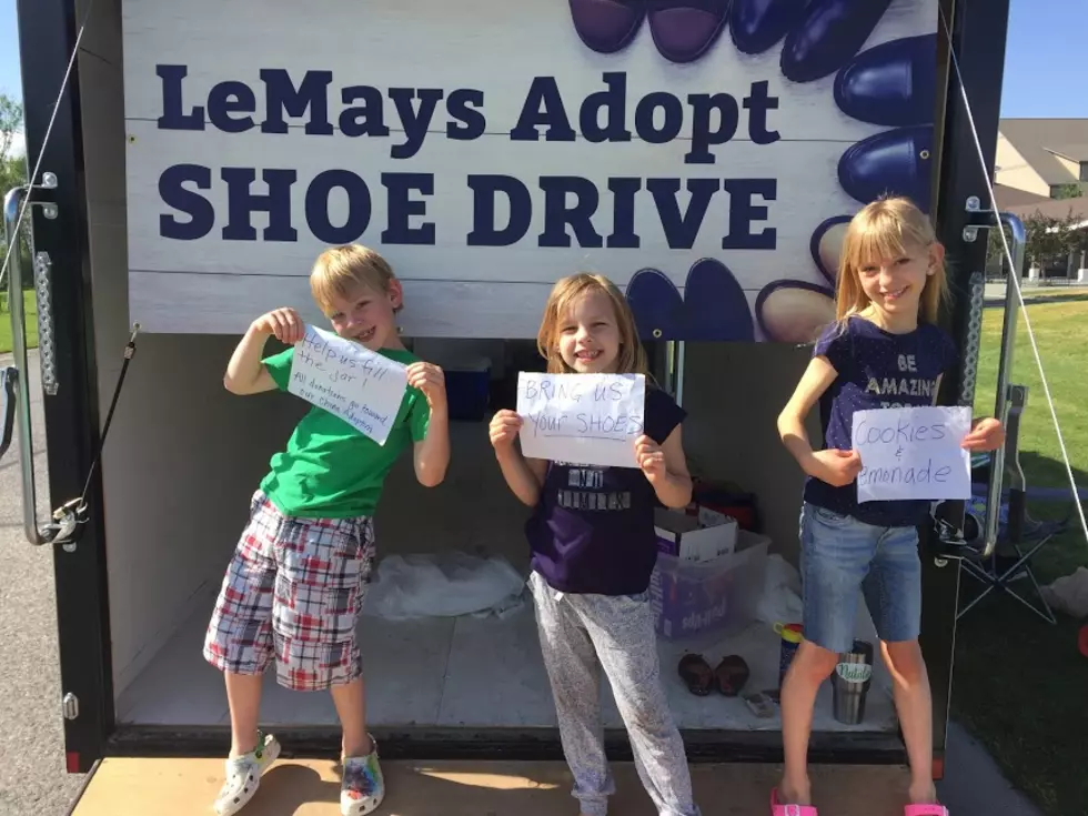 Couple Collecting Shoes For Baby Adoption