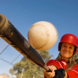 Batter Hitting Softball