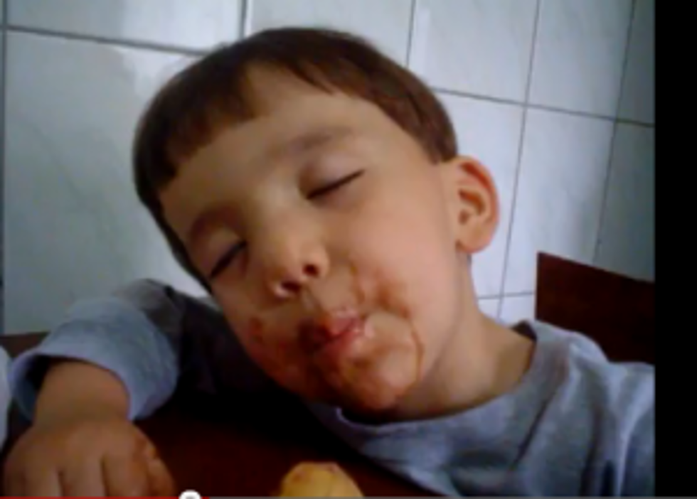 Cute Kid Eats Ice Cream While Sleeping [VIDEO]