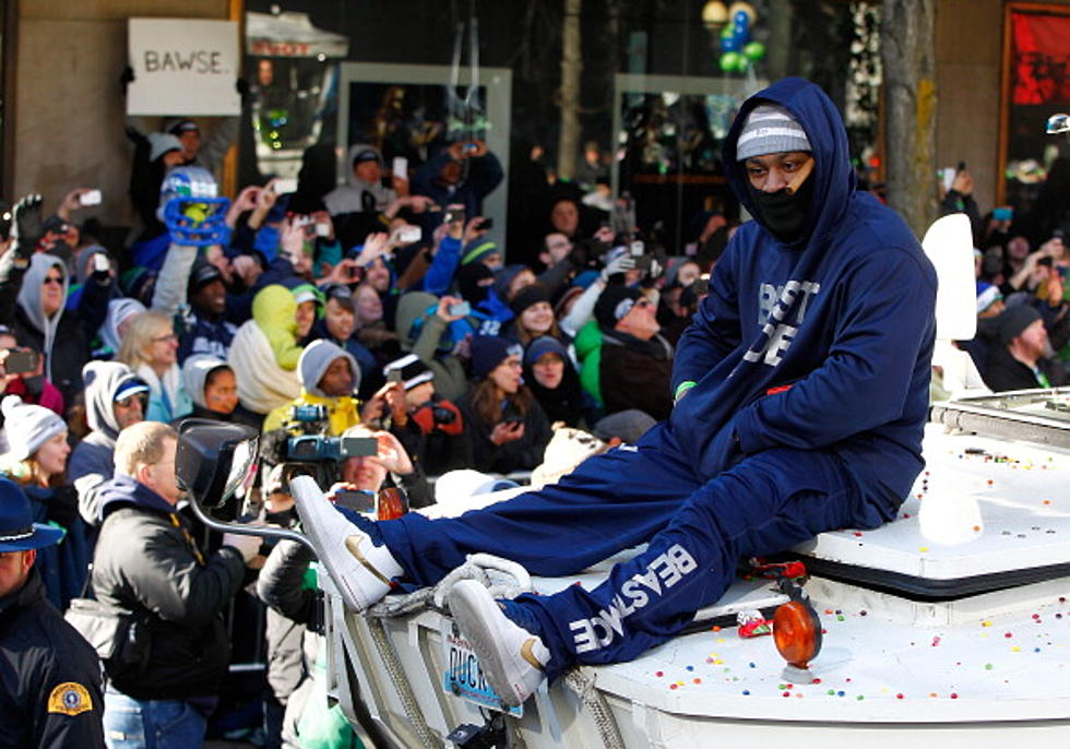 Beast Mode Likes Fireball – Gets a Bottle from a Fan During Super Bowl Victory Parade [VIDEO]