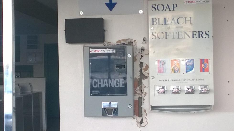 Somebody REALLY Tried to Jack This Laundromat Change Dispenser
