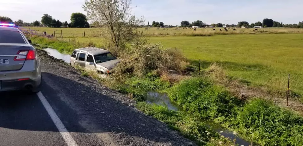 Canal Crash Sinks SUV Door Deep in Mud