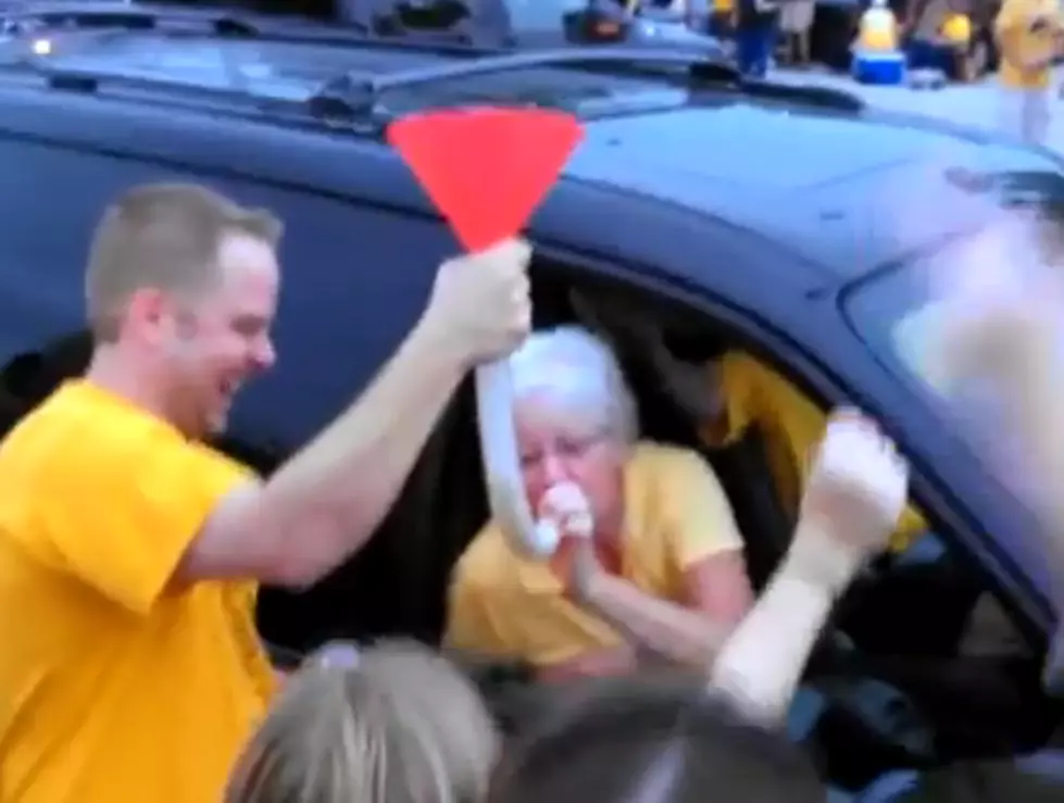 Grandma Celebrates Her Team&#8217;s Win with a Beer Bong [VIDEO]