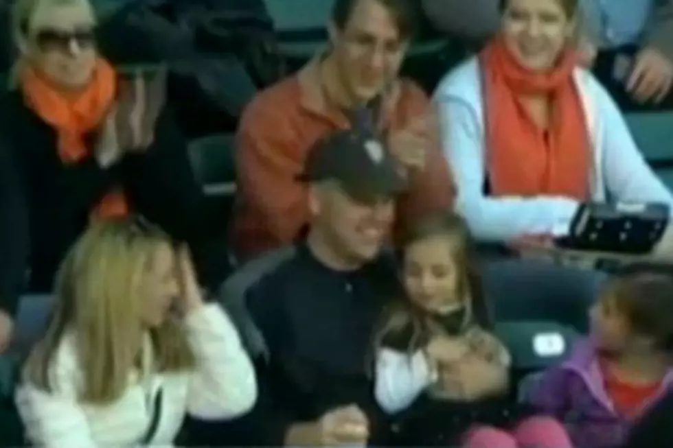 Baseball Fan Catches Foul Ball While Holding Daughter