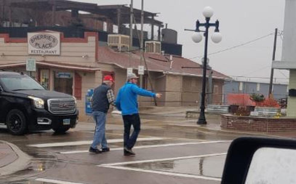 Man Helps Elderly Gentleman Cross the Street in Downtown Casper