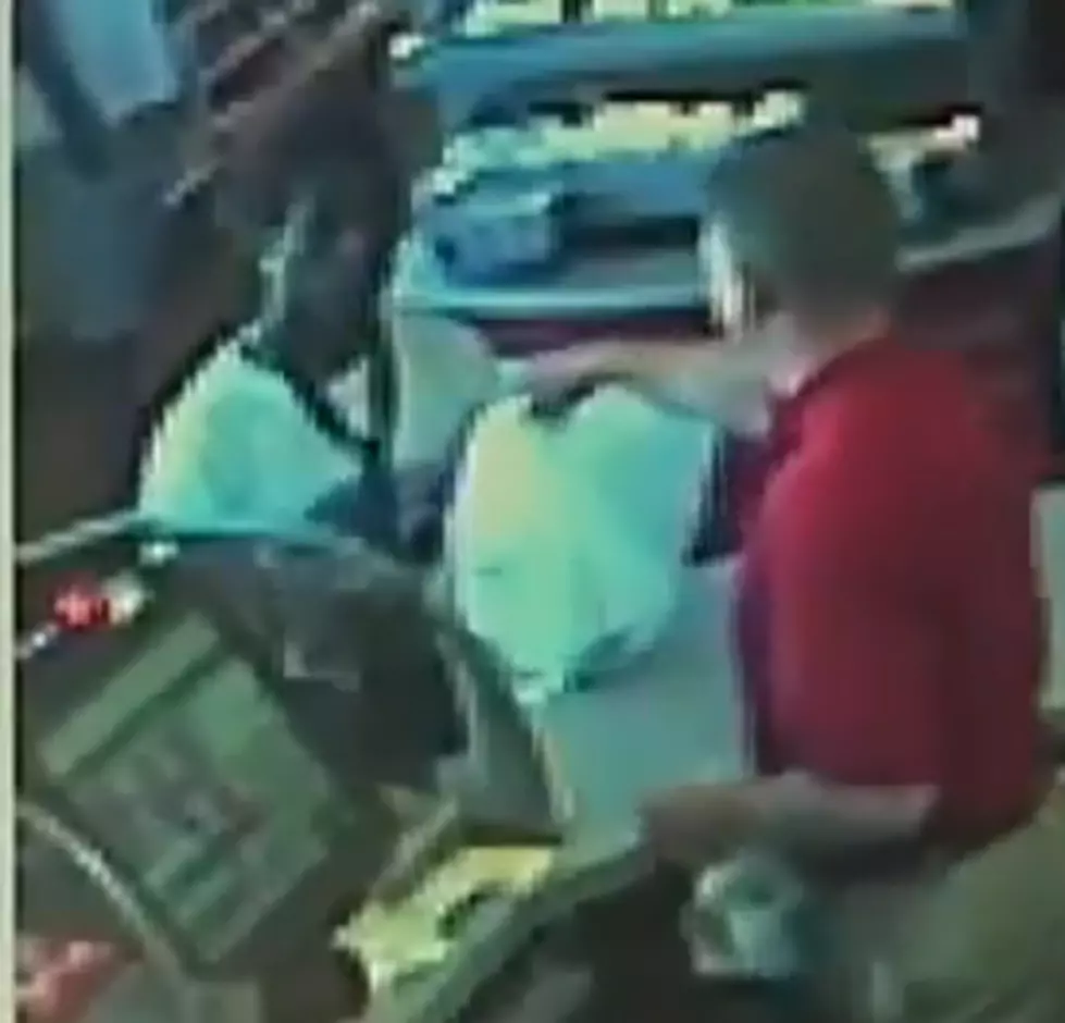 MITM Video of the Day - Man Robs Store with Cop Standing Behind Him