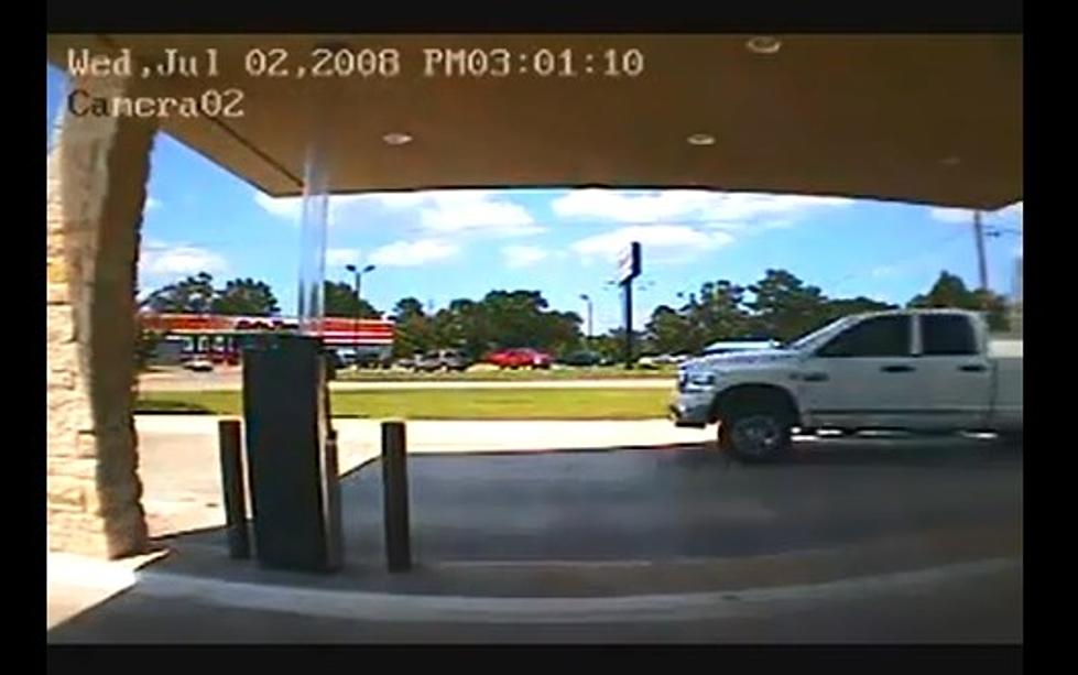 Watch as a Truck Pulling a Camper Crashes Into a Bank Drive Thru