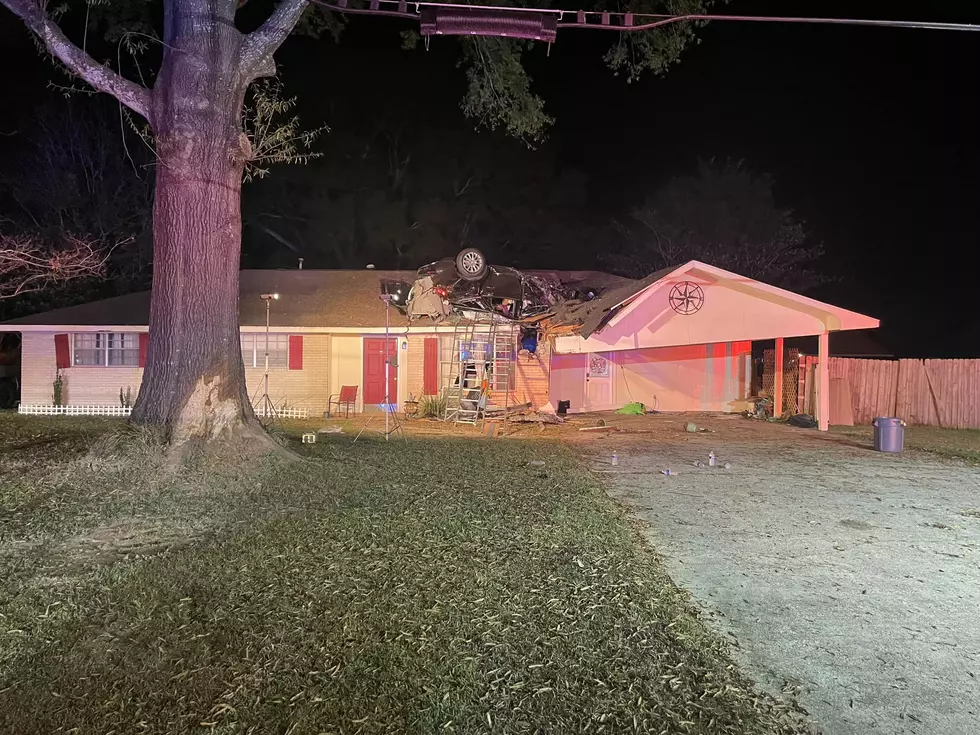 Accident Lands Car Upside Down on Top of Louisiana Home