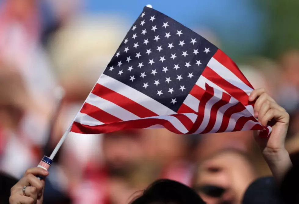 Houston Groundskeeper Photographed in Touching Patriotic Moment