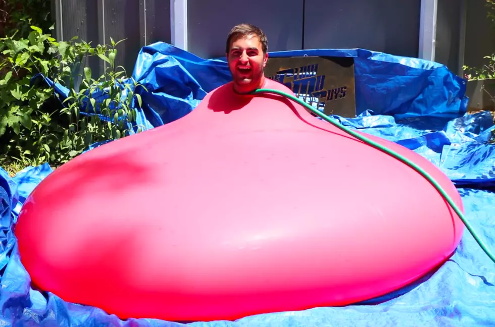 Watch a Huge Water Balloon Explode With Guy a Inside … in Slow Motion