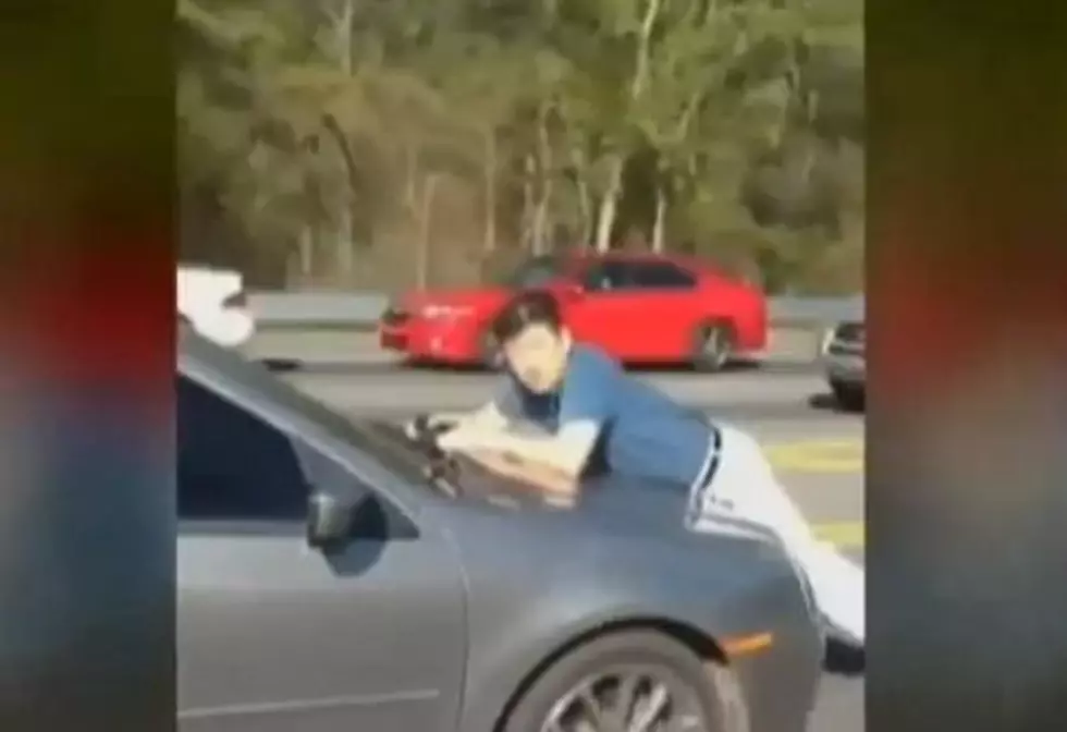 Crazy Woman takes A Man For A Ride On Her Hood [VIDEO]
