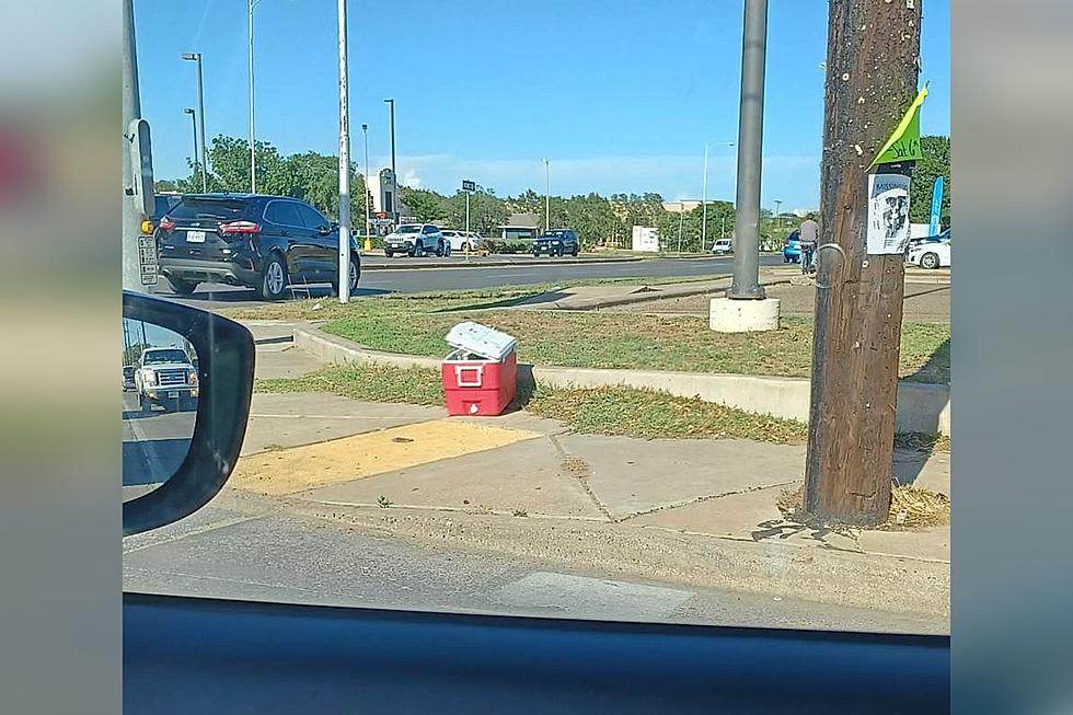What’s Inside The Mysterious Red Cooler At 50th & Slide?