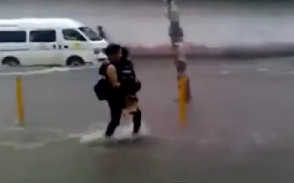 Man Romantically Carries Woman Through Floodwaters Until&#8230;