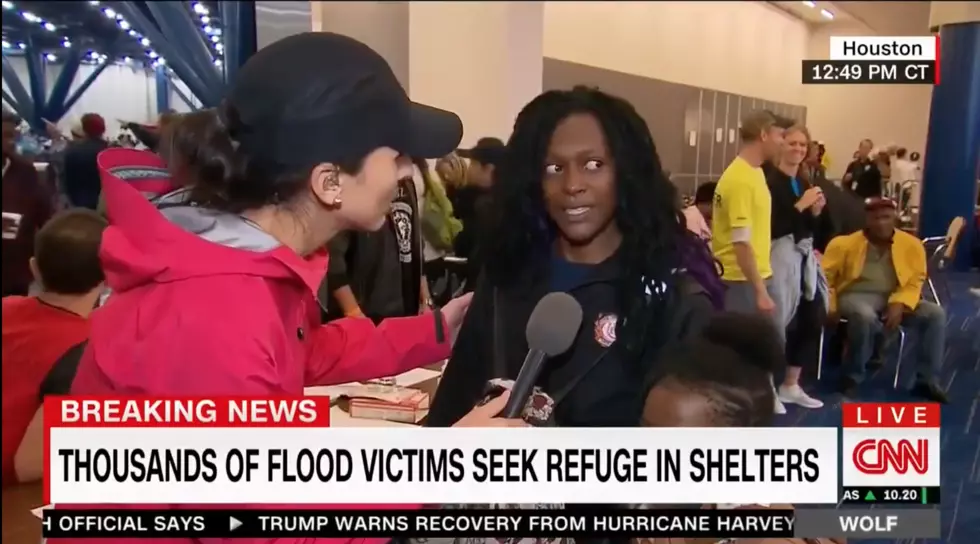Flood Victim Checks Reporter
