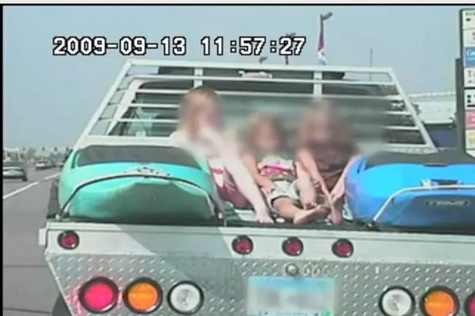 Ramsey Man Driving on the  Highway with 3 Little Kids Sandwiched Between Kayaks on the Back of a Flatbed Truck [VIDEO]