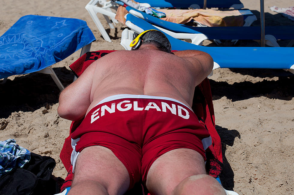 Sunbather Almost has Plane Land on His Back While Face Down in the Sand [VIDEO]