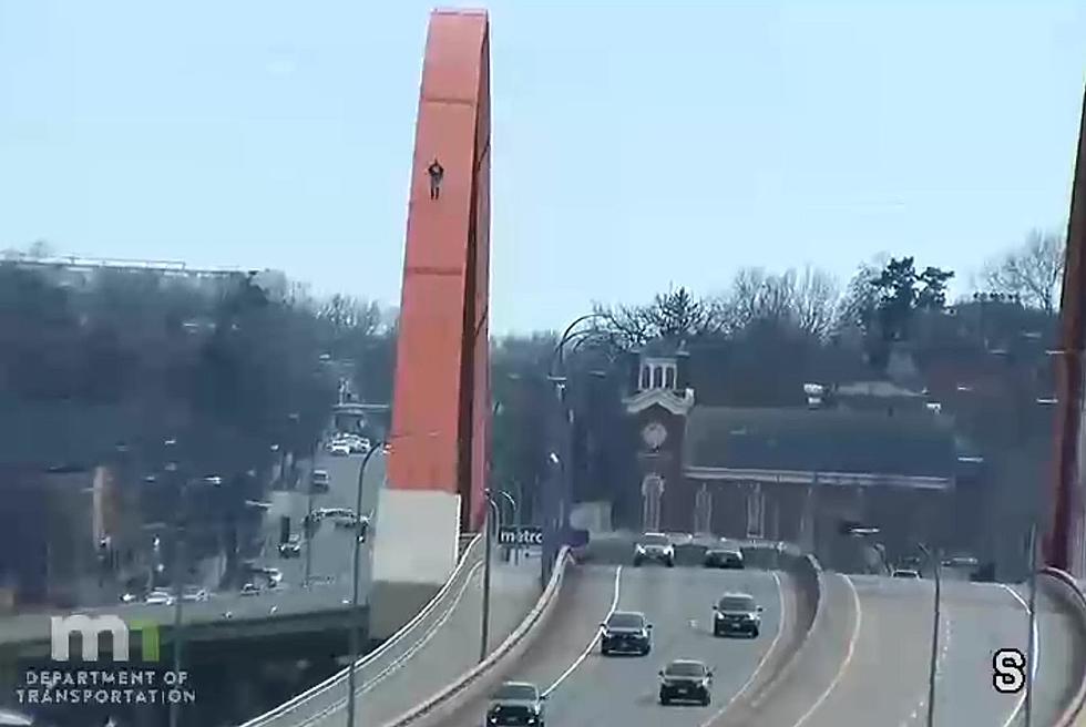 A Man Literally Walks Over A 94-Foot High Steel Arch Bridge In Minnesota