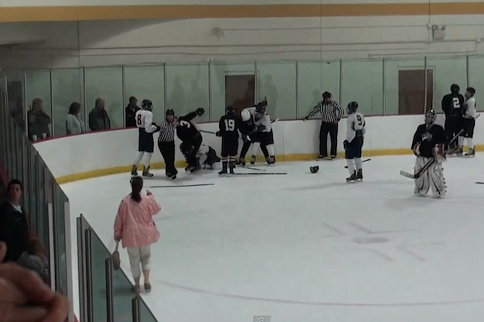 Angry Mom Walks Onto Ice During Youth Hockey Brawl