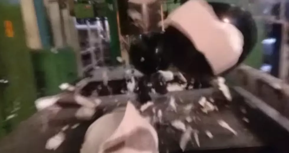 Watch a Bowling Ball Get Crushed by an Hydraulic Press