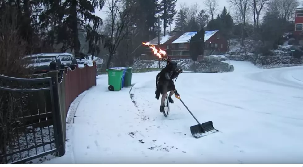 Check Out Darth Vader Shoveling While Riding a Unicycle and Playing Flaming Bagpipes