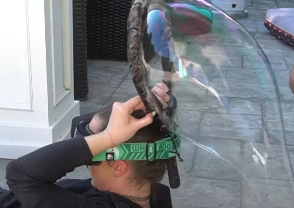 Woman Tries to Blow Giant Soap Bubble With Her Hair [VIDEO]