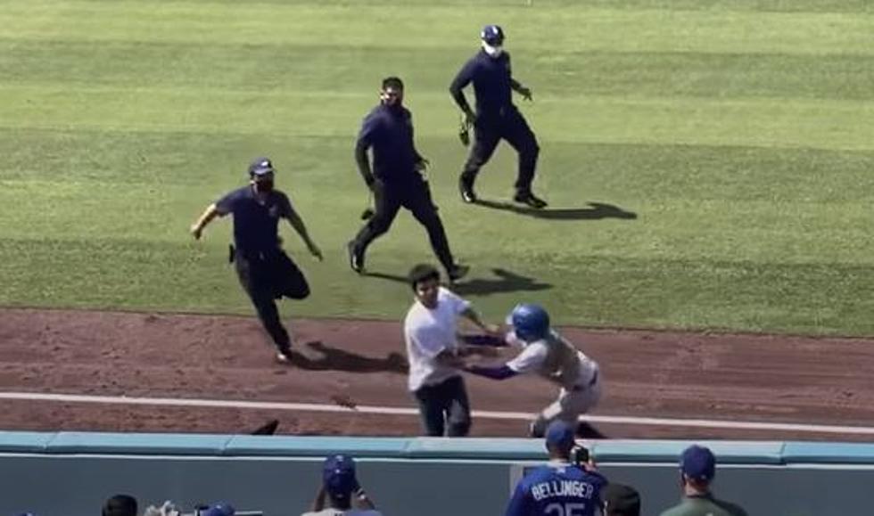 Fan Runs Onto Field, Gets Taken Out By Dodgers’ Ball Girl