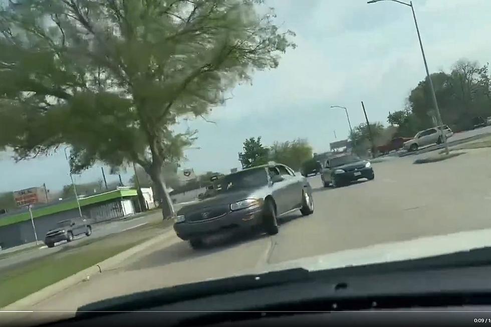 Watch Houston Daredevils Drive Backwards Down Busy Street