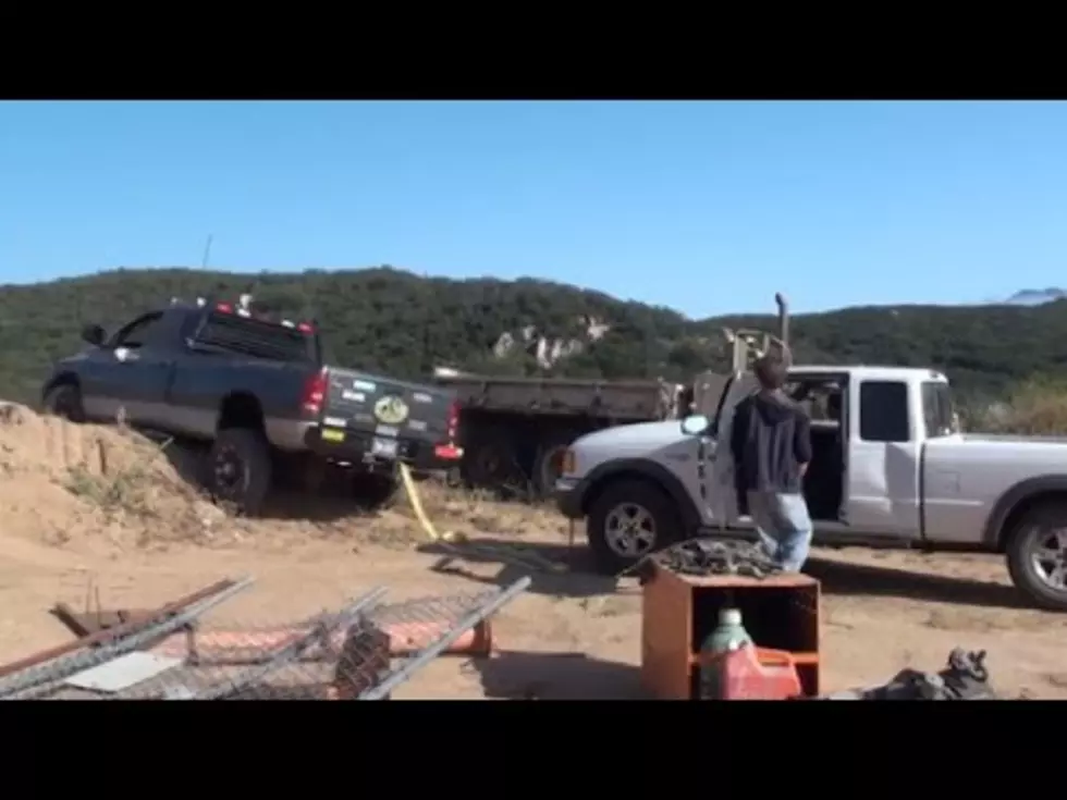 Watch This Dude Fail Miserably While Trying to Help His Buddy Get Unstuck [VIDEO]