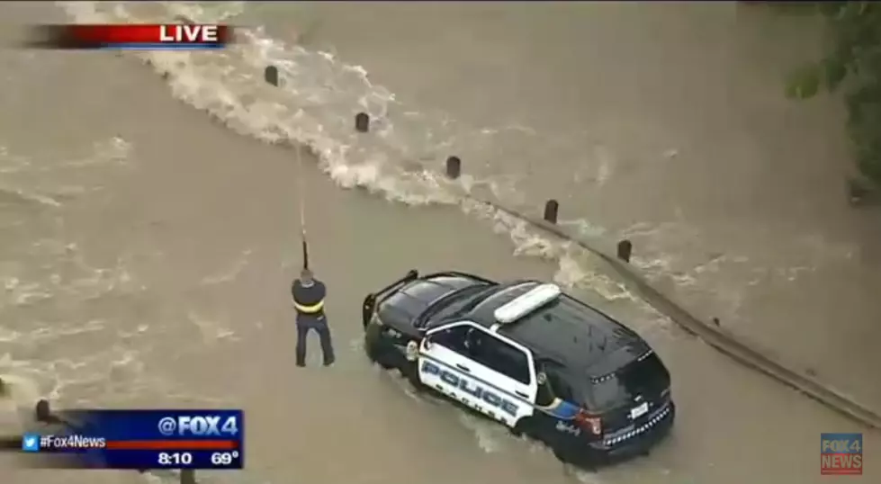 Texas Cop Has to Be Pulled Out By Helicopter from Flood Waters [VIDEO]