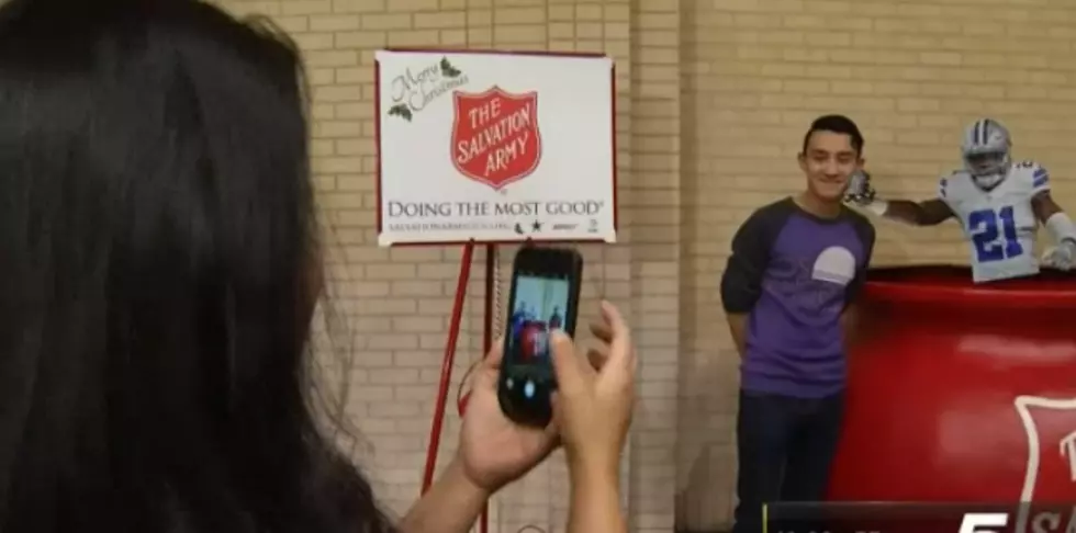 Take a Photo with Ezekiel Elliot in a Salvation Army Kettle at One Dallas Mall