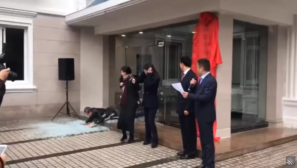 Man Hilariously Crashes Through Glass Door During Ceremony