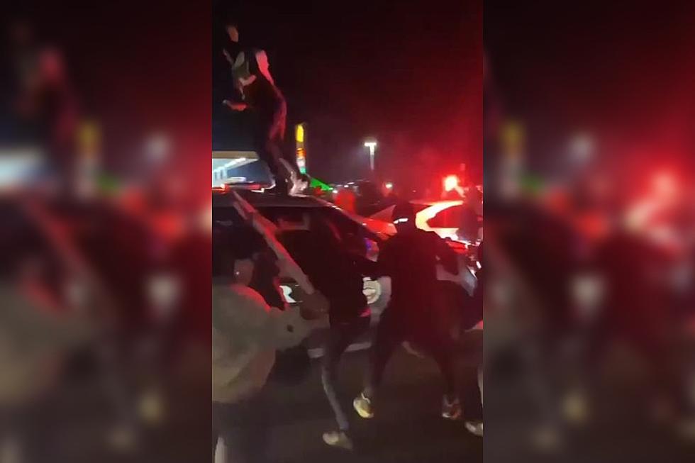 Disturbing Video Shows People Jumping on Police Cars During Austin Street Takeover