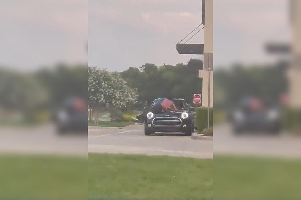 Why Was a Woman Laying on the Hood of a Car at a Dallas Raising Cane’s?