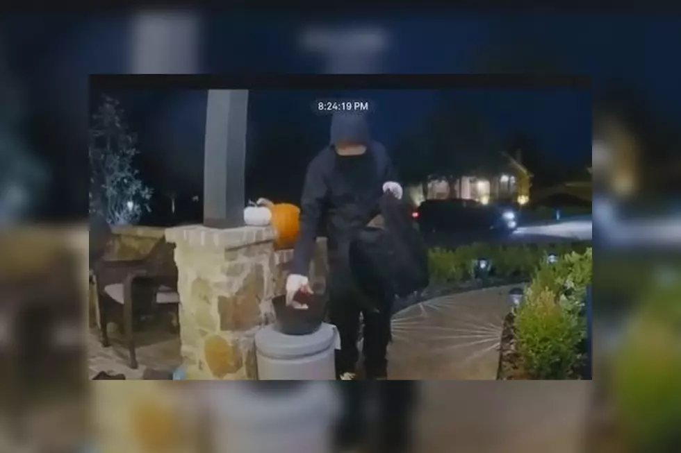Video of Masked Man Putting Halloween Candy in Bowls in Texas