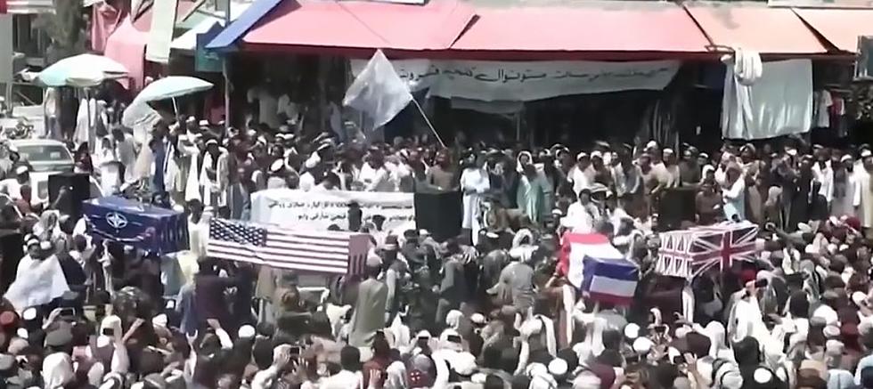 Taliban Supporters Hold Mock Funerals with Coffins Draped with American Flags