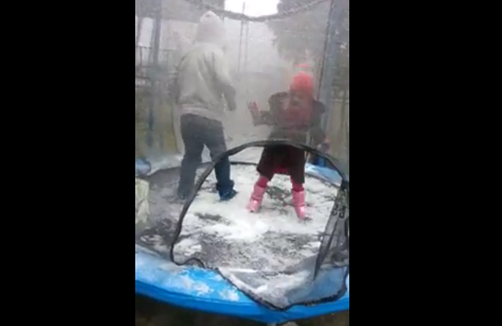 Watch Two Louisiana Kids Jump for Joy on a Snow-Covered Trampoline